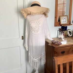 Gently used once from Brazil.Size M. White gauze with white crochet coverup.